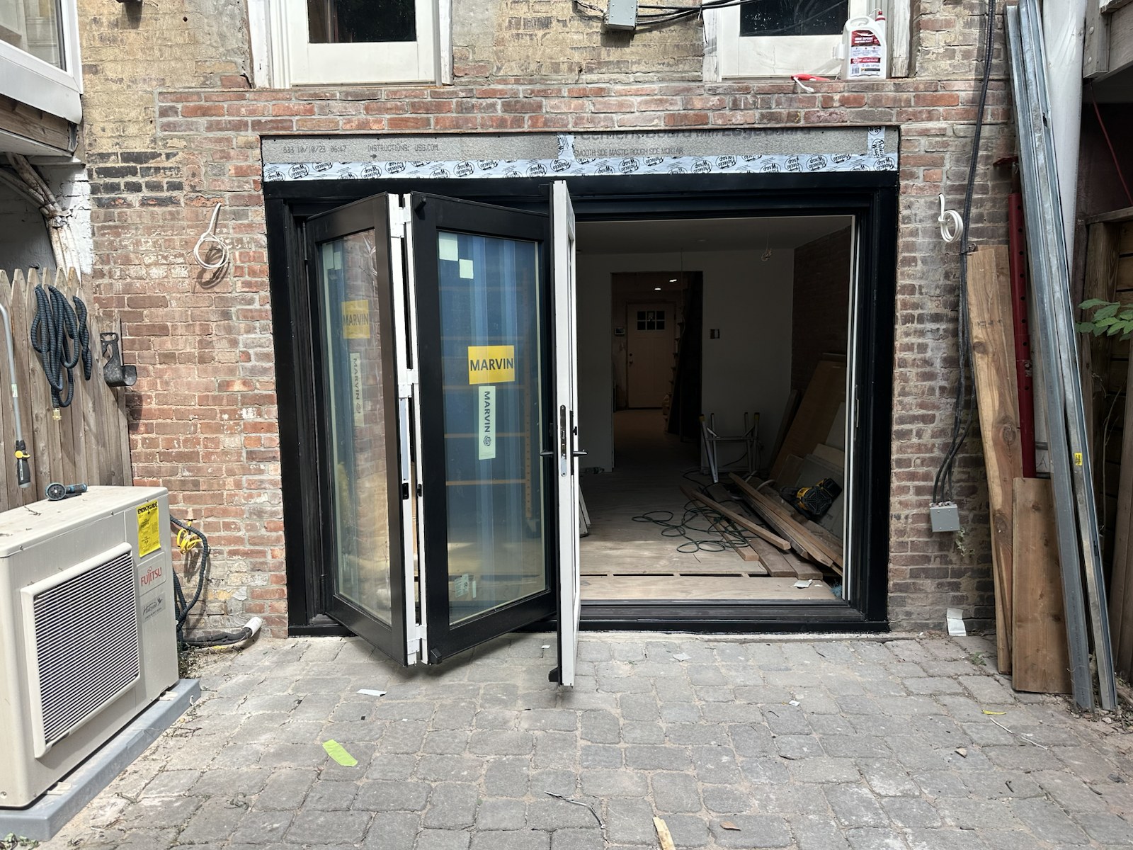 Completed folding patio door opened to the exterior